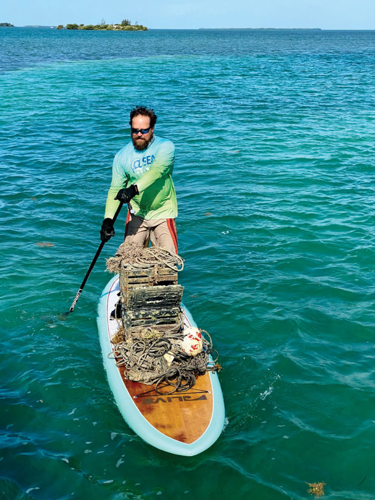 A paddleboarder does his part at the Ghost Trap Rodeo